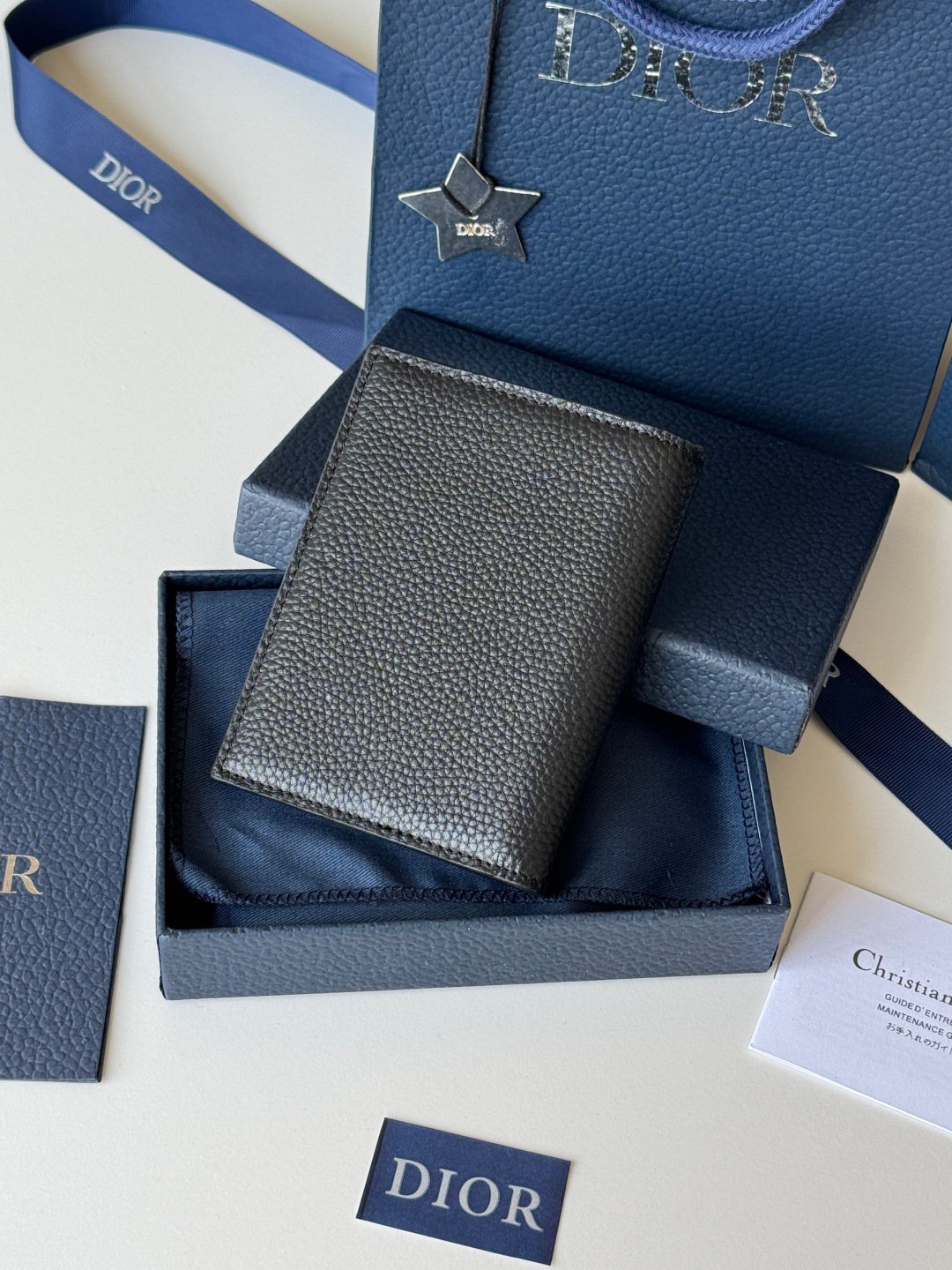 Passport Holder
This passport cover is both practical and elegant. Crafted from beige and black Oblique print fabric with Dior signature on the front and smooth black calf leather interior. Featuring two ticket compartments, a boarding pass compartment and five card slots. This passport holder is an ideal travel companion and can also be used as a card holder. Beige and black Oblique print Metallic-clad brass Dior signature on front Embossed Dior signature on interior Bi-fold style 2 receipt compartments 5 card slots Boarding pass compartment Dust bag included
Dimensions: 10 x 13.3cm
No.: H016-H020 Saddle Passport - Image 3