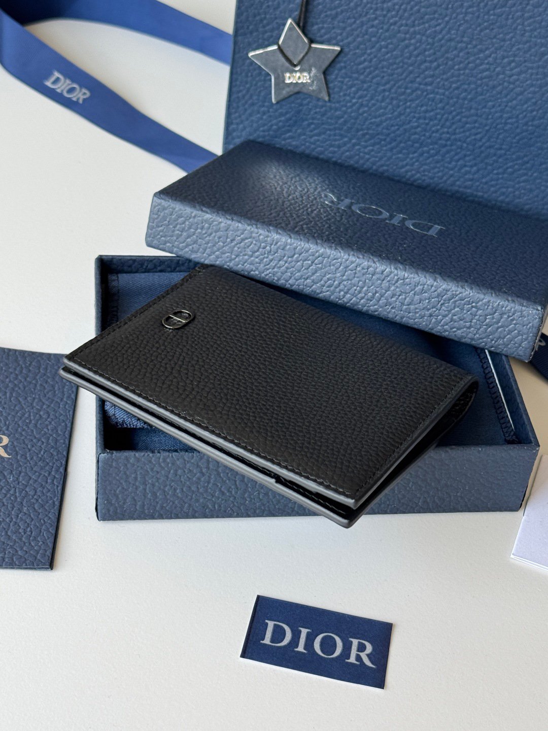 Passport Holder
This passport cover is both practical and elegant. Crafted from beige and black Oblique print fabric with Dior signature on the front and smooth black calf leather interior. Featuring two ticket compartments, a boarding pass compartment and five card slots. This passport holder is an ideal travel companion and can also be used as a card holder. Beige and black Oblique print Metallic-clad brass Dior signature on front Embossed Dior signature on interior Bi-fold style 2 receipt compartments 5 card slots Boarding pass compartment Dust bag included
Dimensions: 10 x 13.3cm
No.: H016-H020 Saddle Passport - Image 4